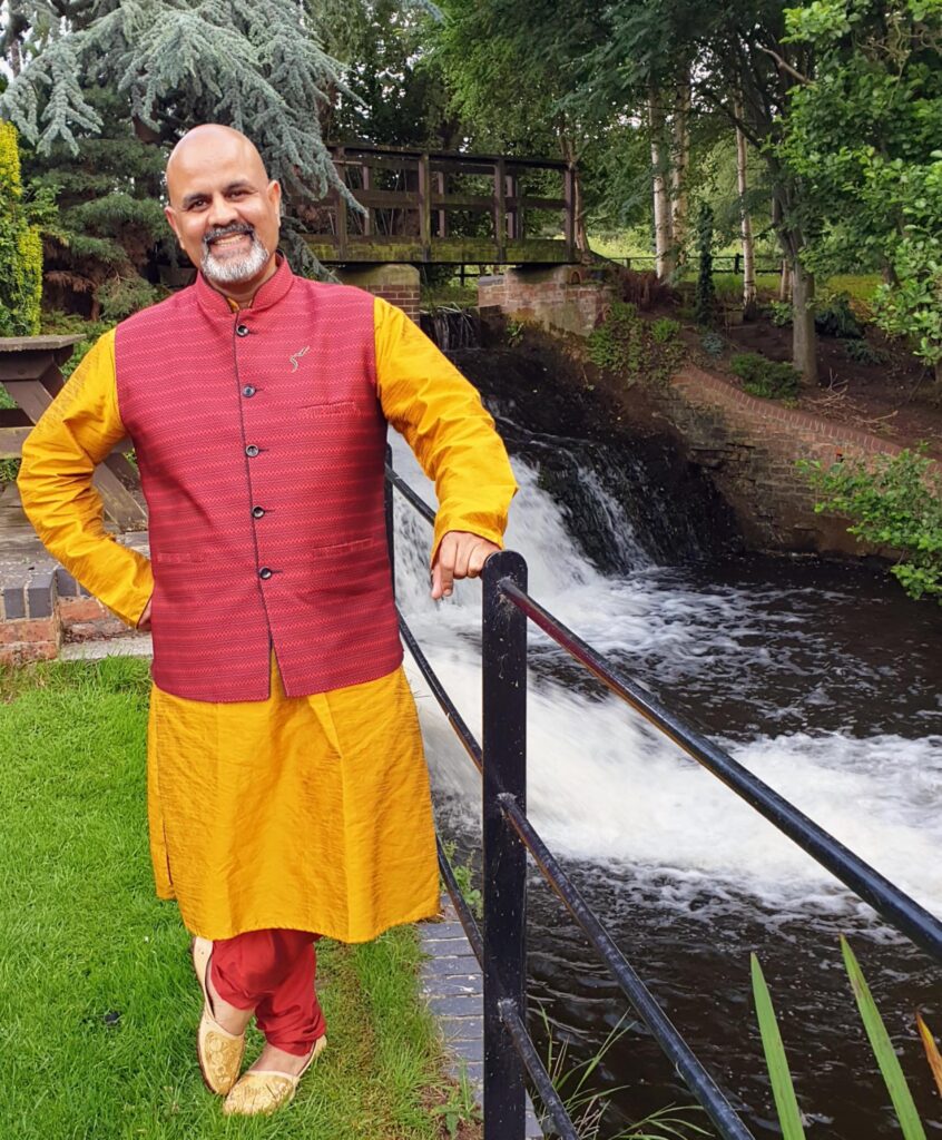 an image of a man wearing traditional Indian outfit. outdoor. 